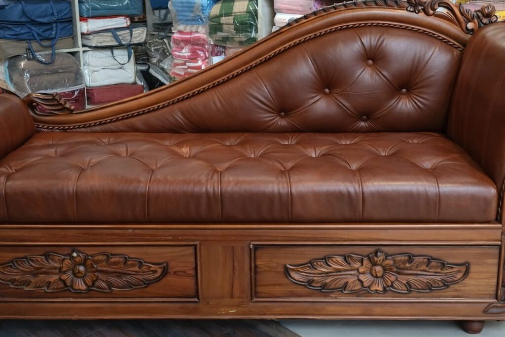 This is an old sofa , its fabric is leather and its remade beautifully at our store, You don't have to buy a costly  new sofa when u can remake it 